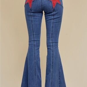 Trendy Blue Flare Jeans with Red Star Accents